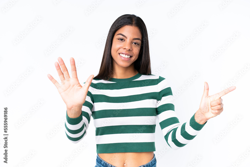 Young African American woman isolated on white background counting seven with fingers Young African American woman isolated on white background counting seven with fingers