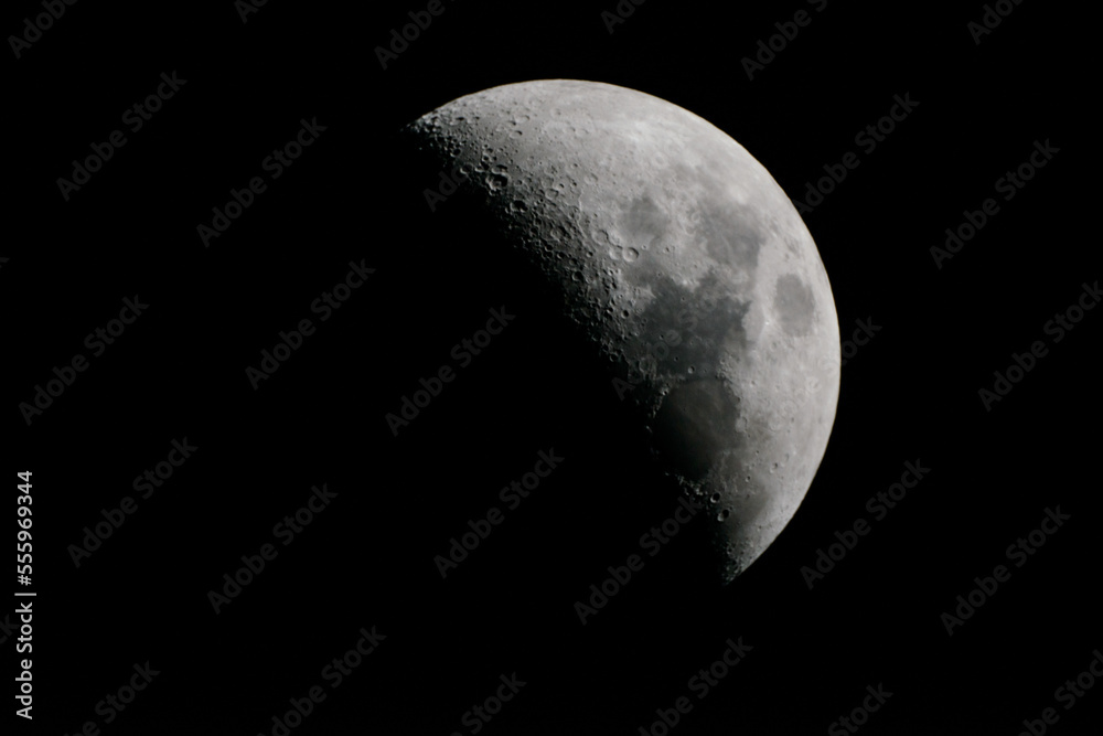 hlaf moon in front of black sky hlaf moon in front of black sky