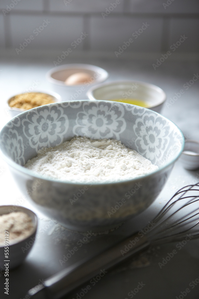 Bowl of Flour with Whisk and Baking Ingredients, Studio Shot Bowl of Flour with Whisk and Baking Ingredients, Studio Shot
