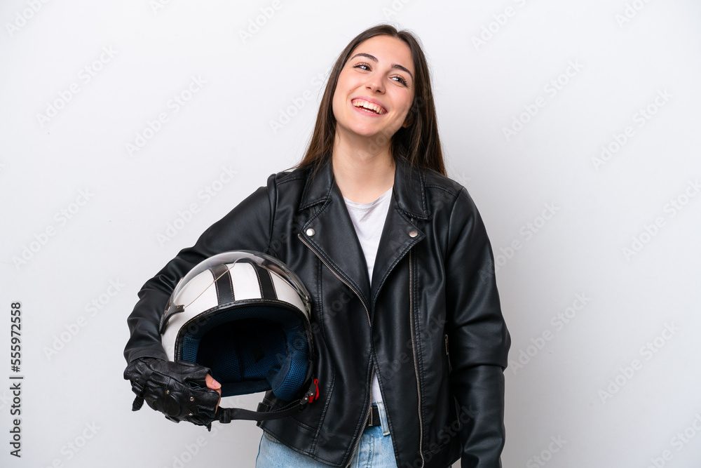 Young girl with a motorcycle helmet isolated on white background laughing Young girl with a motorcycle helmet isolated on white background laughing