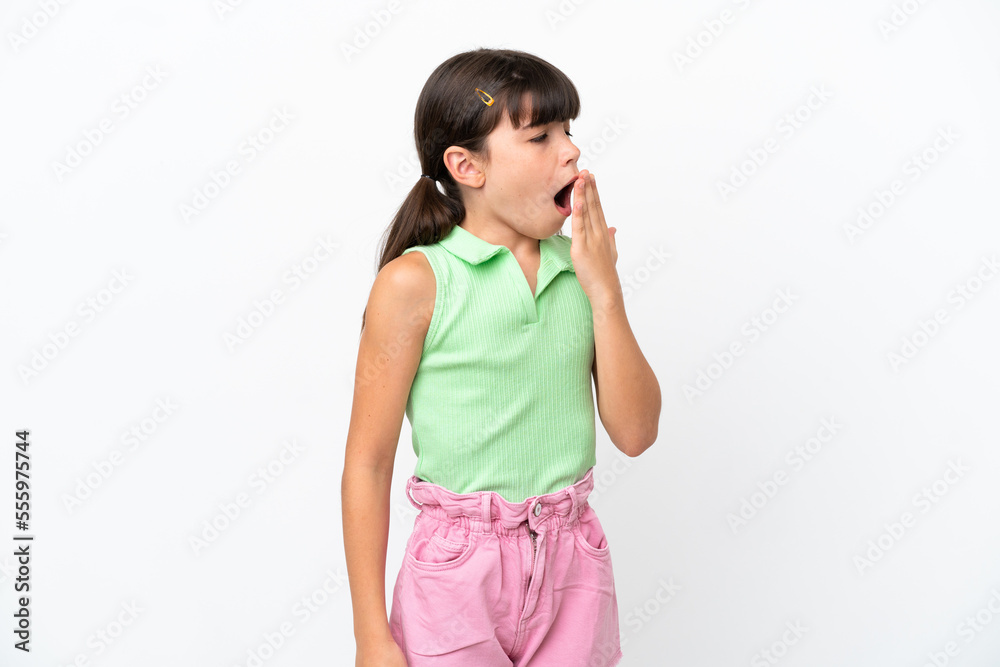 Little caucasian kid isolated on white background yawning and covering wide open mouth with hand Little caucasian kid isolated on white background yawning and covering wide open mouth with hand