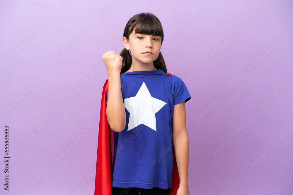 Little kid isolated on purple background in superhero costume Little kid isolated on purple background in superhero costume