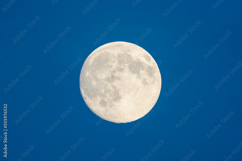 Full moon in sky at dusk, Odenwald, Hesse, Germany Full moon in sky at dusk, Odenwald, Hesse, Germany