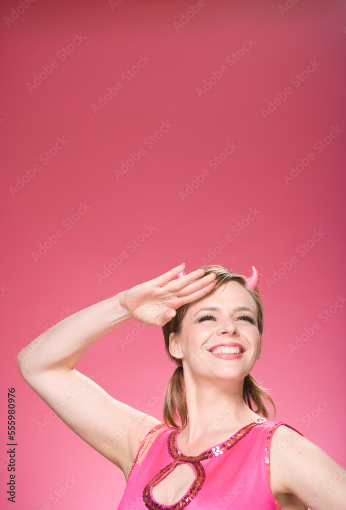 Portrait of Woman Wearing Devil Horns and Saluting Portrait of Woman Wearing Devil Horns and Saluting