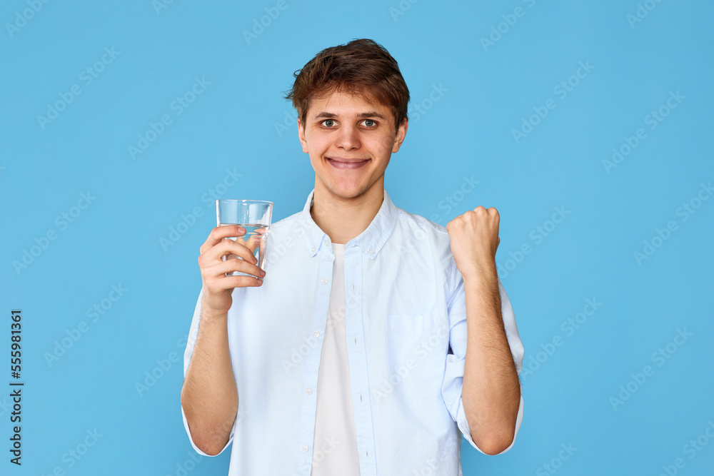 Young handsome man with drinking glass of water Young handsome man with drinking glass of water
