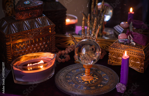 Astrology and esoteric concept. Altar with zodiac signs some stuff for horoscope  candles and mystical atmosphere