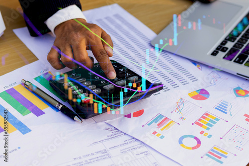 person analyzing financial data charts photo