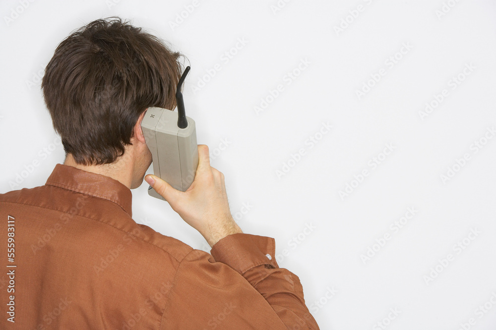 Man Talking on Old Fashioned Cellular Phone Man Talking on Old Fashioned Cellular Phone