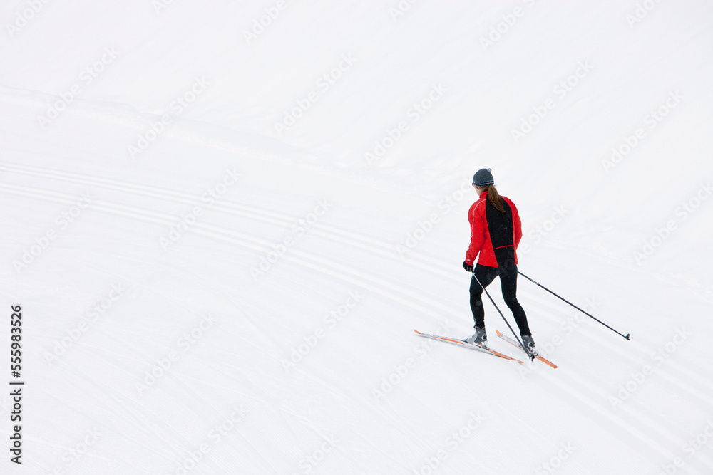 Backview of Woman Cross Country Skiing, Whistler, British Columbia, Canada Backview of Woman Cross Country Skiing, Whistler, British Columbia, Canada
