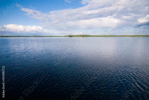 lake with clouds in summer noon