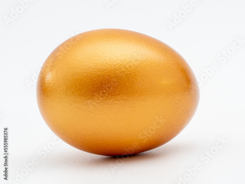 Golden eggs on a white background. Golden chicken eggs.