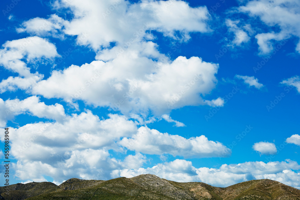 Clouds against Blue Sky over Mountain Range, Majorca, Balearic Islands, Spain Clouds against Blue Sky over Mountain Range, Majorca, Balearic Islands, Spain