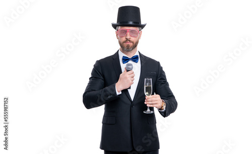 showman man entertainer cheering with microphone. man showman wear tuxedo cheering in studio