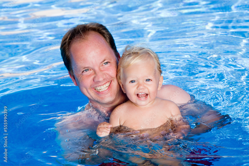 Father and Baby in Swimming Pool Father and Baby in Swimming Pool