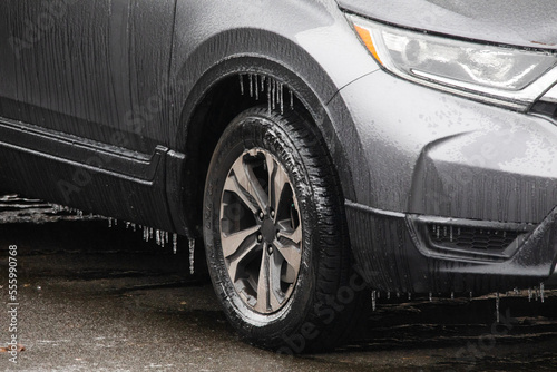 Icicles hanging off a frozen car during Winter Storm Elliot