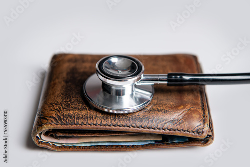 closeup of stethoscope and wallet as symbol of medical insurance. life planning