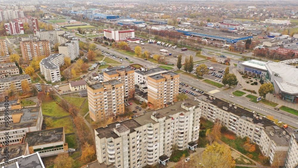 Panoramic bird's eye view of Brest in Belarus. Outskirts of Brest. Brest from above. Eastern Europe in autumn at rainy time. Gray and orange city.