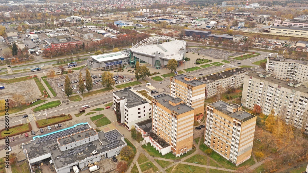 Panoramic bird's eye view of Brest in Belarus. Outskirts of Brest. Brest from above. Eastern Europe in autumn at rainy time. Gray and orange city.