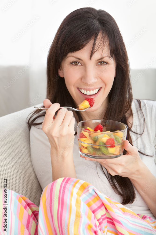 Close-up of Woman Eating Bowl of Fruit Close-up of Woman Eating Bowl of Fruit