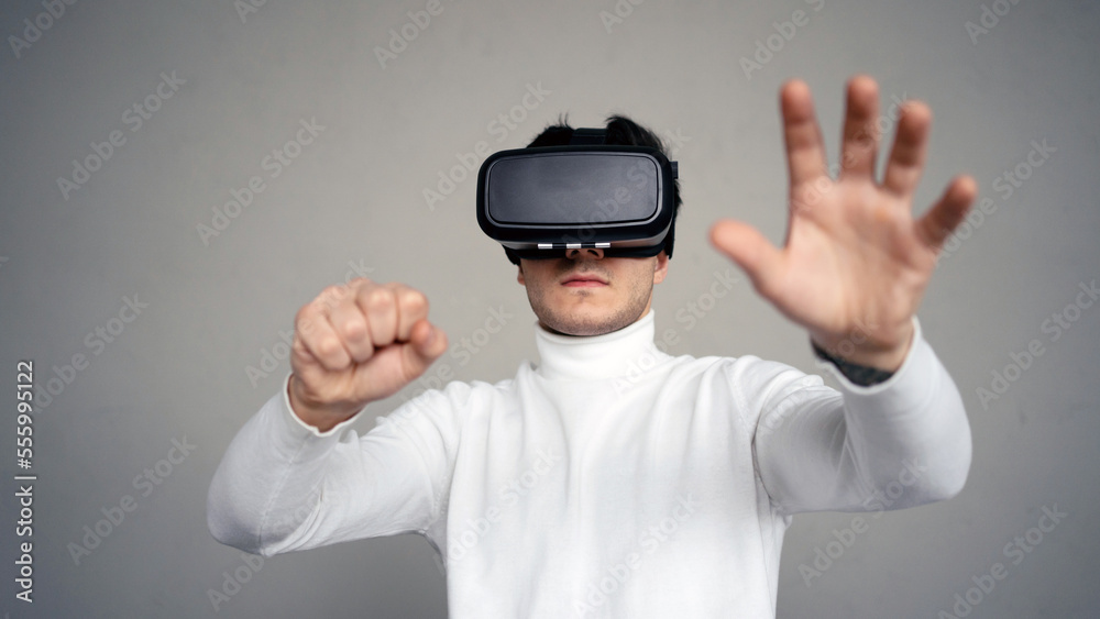 A man uses virtual reality glasses, plays a video game. A man uses virtual reality glasses, plays a video game.
