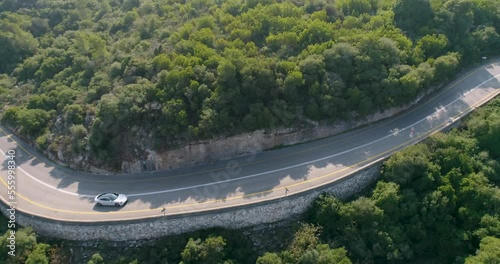 Aerial view of a sport car driving in a woodland, Carmel Forest, Haifa, Israel photo