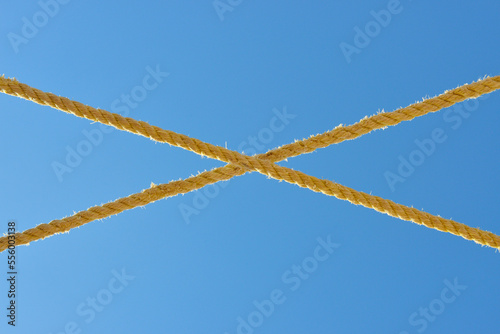 Close-up of Crossed Rope in front of Blue Sky, Matruh, Great Sand Sea, Libyan Desert, Sahara Desert, Egypt, North Africa, Africa photo
