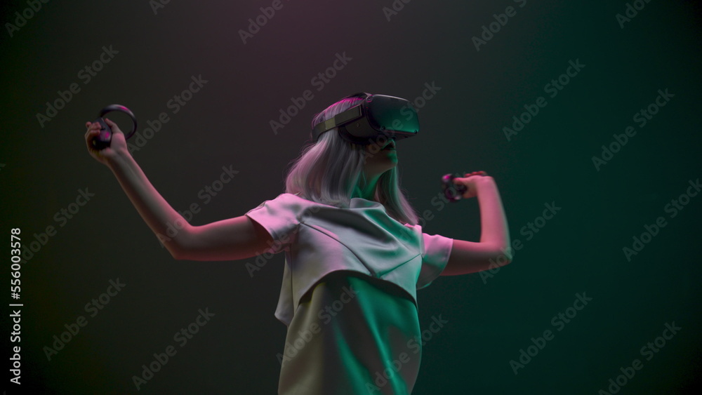 Excited woman experiencing handheld trackpads videogame closeup. Future concept
