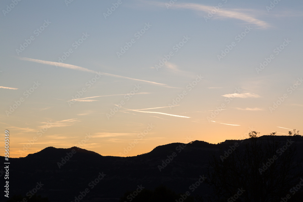 sky streaked by aircraft trails at dusk in the autumn season sky streaked by aircraft trails at dusk in the autumn season