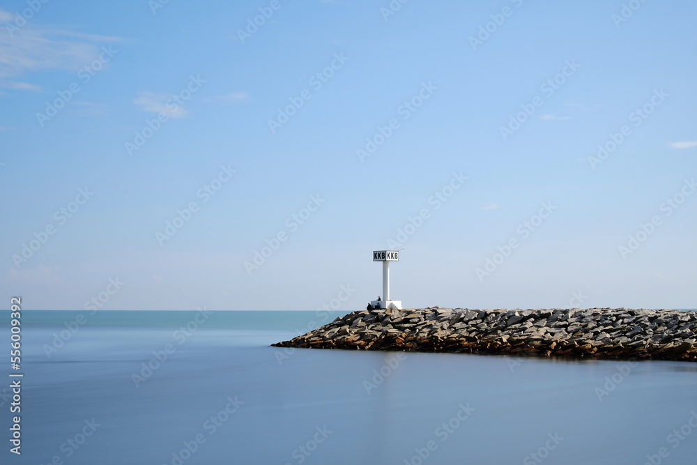 Lighthouse and sea with blue sky