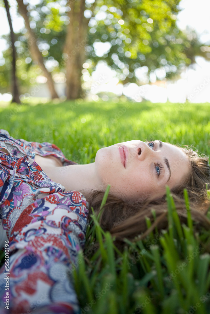 Woman Lying on Grass, Miami Beach, Florida, USA Woman Lying on Grass, Miami Beach, Florida, USA