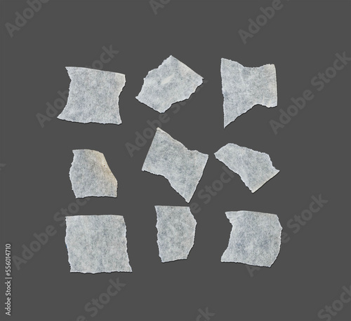 Torn white masking tape isolated on gray paper background