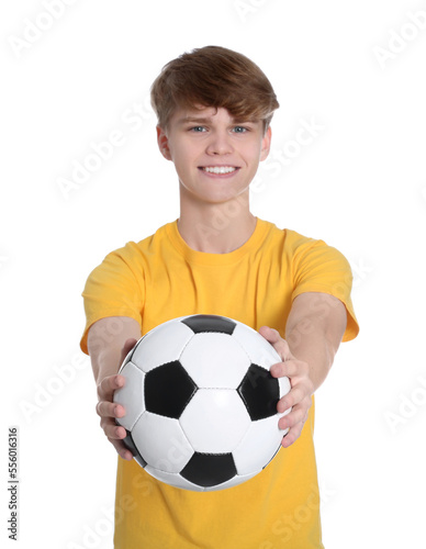 Teenage boy with soccer ball on white background