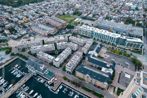 Aerial Drone View of Baltimore City Harbor with Boats Parked at Docks