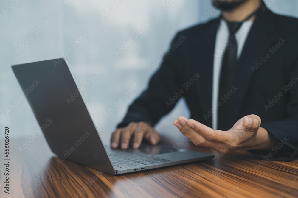 People using computer Side view of male hands typing on laptop keyboard
