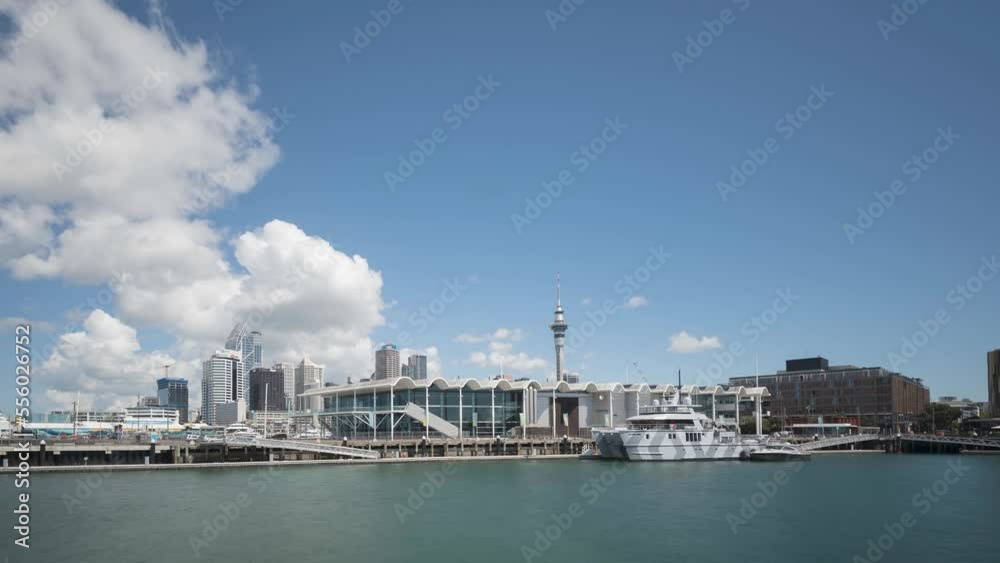 Time lapse of fluffy, white, cumulus clouds in a blue sky forming over central Auckland, New Zealand. Viewed from Viaduct Basin. Time lapse of fluffy, white, cumulus clouds in a blue sky forming over central Auckland, New Zealand. Viewed from Viaduct Basin.