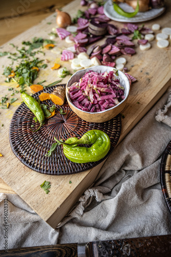 Fototapeta Naklejka Na Ścianę i Meble -  Brightly colored radishes and other fall vetables on a plate - healthy, vegan food ingredients