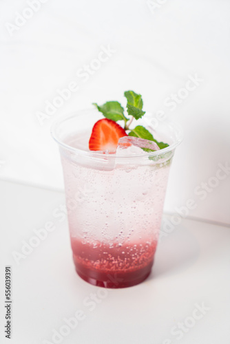 strawberry with soda in glass