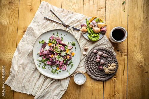 Flatlay image of plates of colorful and healthy food, ingredients