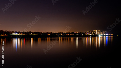 Reflecting town lights in lake. © Albert Jackson