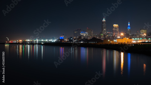 Reflecting colorful city lights in lake. © Albert Jackson