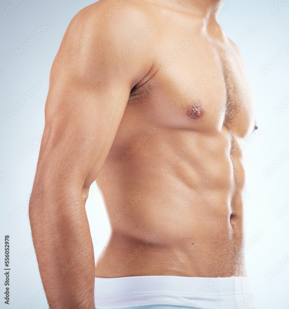 Fitness, wellness and body of man in studio with muscles for healthy lifestyle, workout and bodybuilder training. Motivation, exercise and muscular torso, abdomen and stomach of athlete in underwear Fitness, wellness and body of man in studio with muscles for healthy lifestyle, workout and bodybuilder training. Motivation, exercise and muscular torso, abdomen and stomach of athlete in underwear