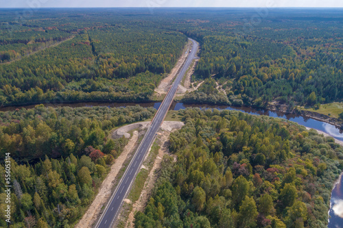 Aerial view of the R-243 highway and the bridge across the Mezha river on a September day. Kostroma region, Russia