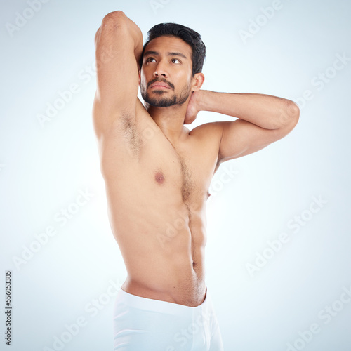 Asian man, fitness vision and stretching body for exercise wellness, body care workout motivation and positive goals mindset in studio background. Sports athlete, strong healthy man and model flexing