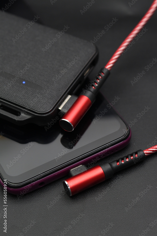 Red data cable with powerbank and smartphone Red data cable with powerbank and smartphone