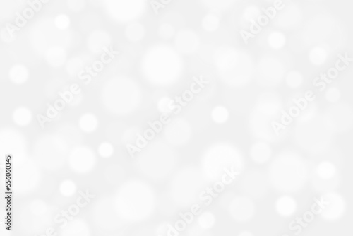 Abstract bokeh light snowfall background. Soft gray and white bokeh background. New Year, Christmas, Winter and all celebration background concept. 