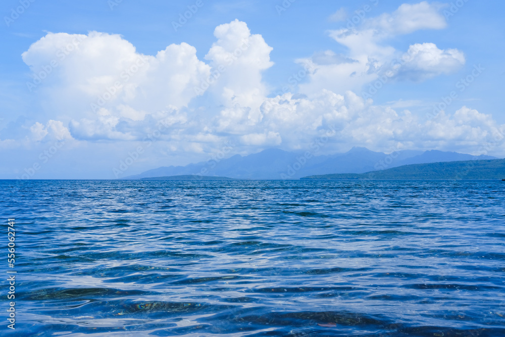 Fototapeta premium sunny day at Bangsring Beach Banyuwangi, floating house in the ocean, blue sky and sea, sea and sky, boat in the sea, beach and sea