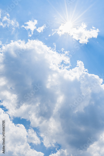 Clouds and sunny blue sky.
Sunny background, blue sky with white clouds and shine sun