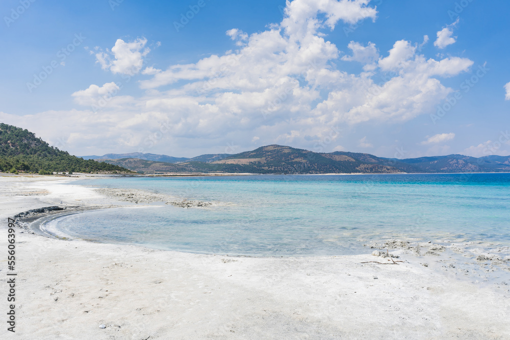 The turquoise waters of Salda Lake, the white mineral-rich beach and the blue sky. Salda Lake is a turquoise crater lake.
Salda Lake, Burdur, Turkey