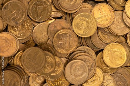 Old coins of the USSR in bulk on a flat surface, background image.