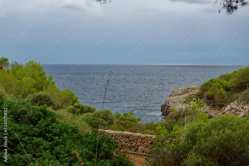 Mallorca Island, Spain, with beautiful scenic view over Mediterranean Sea with cloudy sky background on an autumn day. Photo taken October 11th, 2022, Mallorca Island, Spain. Mallorca Island, Spain, with beautiful scenic view over Mediterranean Sea with cloudy sky background on an autumn day. Photo taken October 11th, 2022, Mallorca Island, Spain.